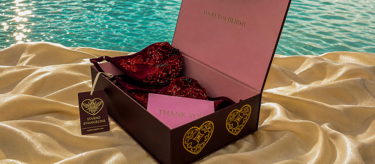 Crimson Evangeline Bikini displayed in Studio Evangeline packaging with a branded hang tag and thank-you card.